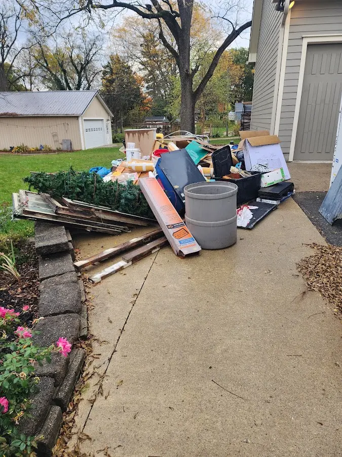 Dumpster being loaded with debris for 3 Yard Dumpster Rental in Corinth